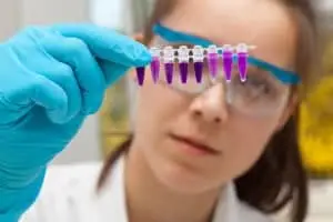 medical-lab-tech-examining-test-tubes
