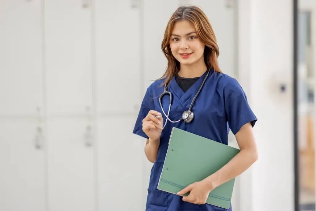 Young female Asian medical assistant in clinic.